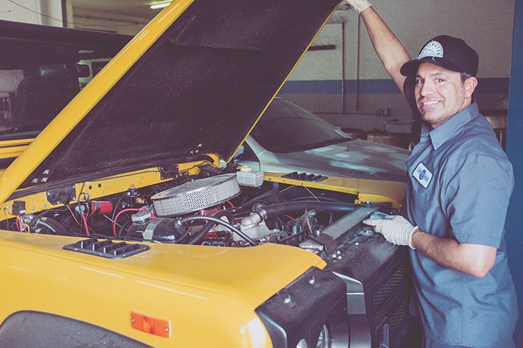 Mechanic working on car.